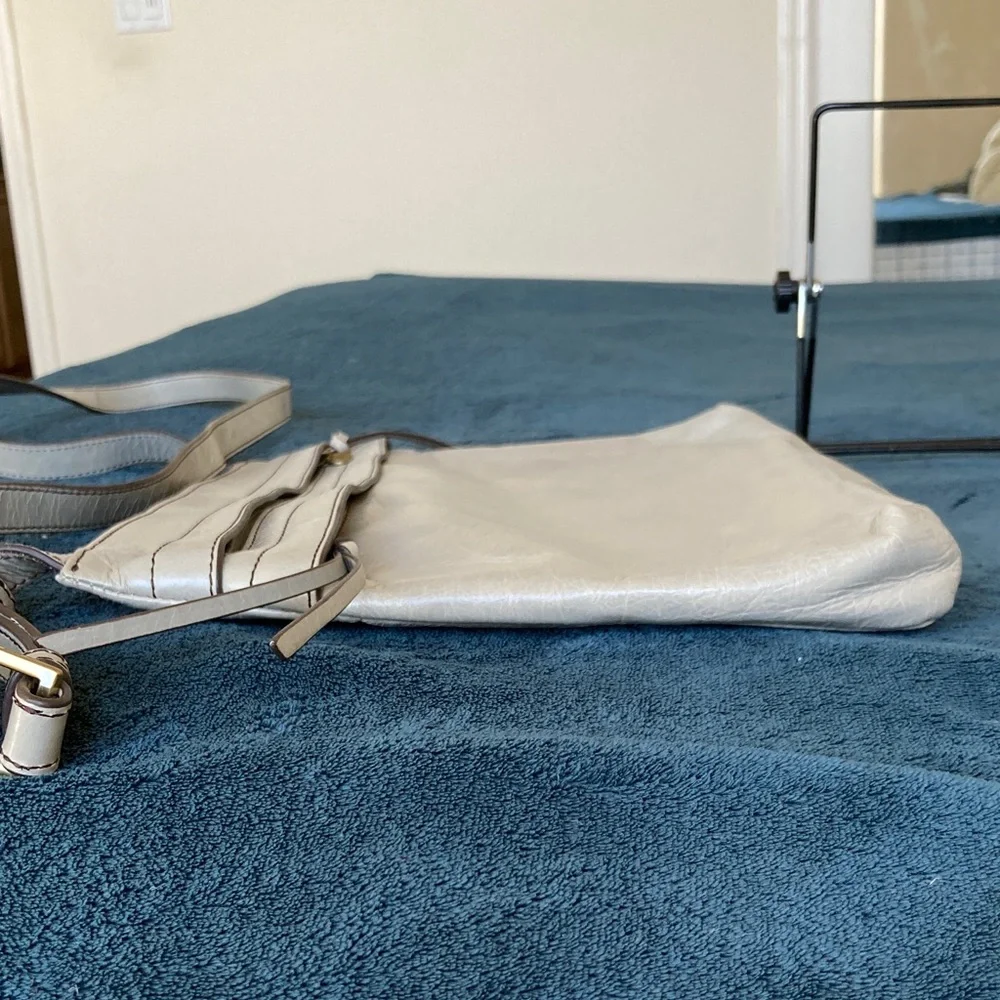 Hobo Larkin crossbody bag in a gray distressed leather